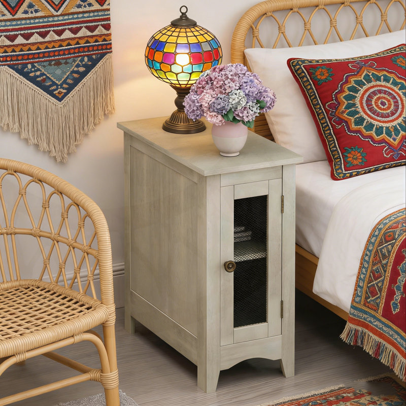 Table d'appoint rectangulaire étroite avec armoire de rangement et porte grillagée en métal pour une polyvalence compacte.
