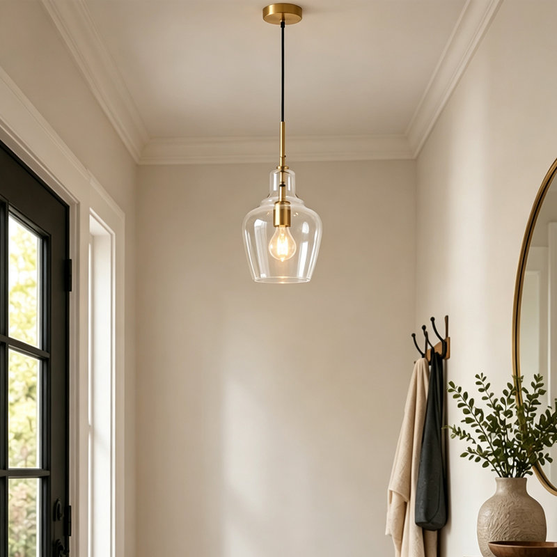 Suspension simple à une lumière, abat-jour en verre transparent, cordon réglable, idéal pour îlot de cuisine ou salle à manger.