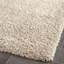 Tapis à poil long de couleur unie Performance Angeliya-19276464