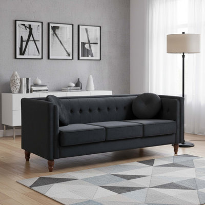 Canapé Chesterfield classique avec revêtement en velours côtelé et structure en bois massif pour un confort optimal dans votre salon.