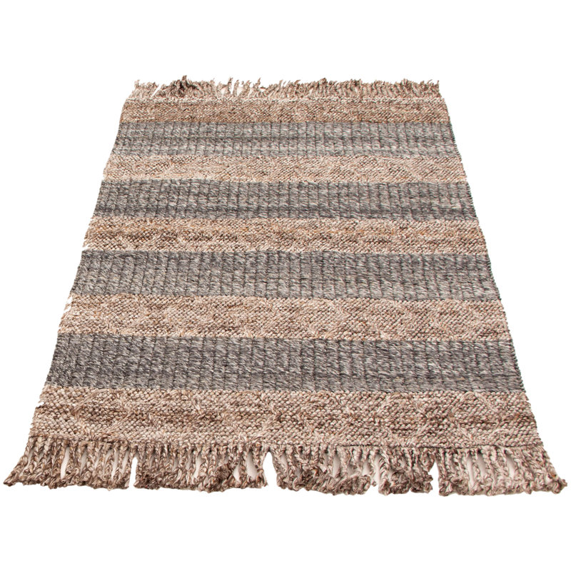 Tapis gris foncé en laine tressé à la main