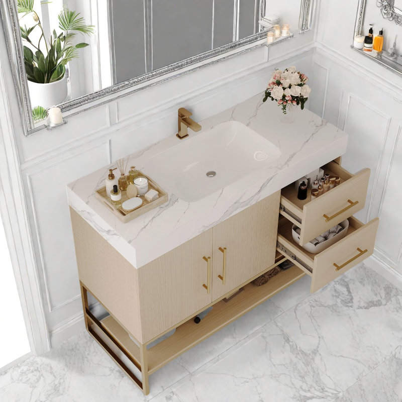 Meuble-lavabo moderne spacieux avec lavabo sans couture et accents dorés