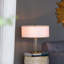 Lampe de table avec cylindre en verre et base piédestal