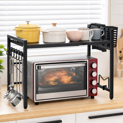 Adjustable Expandable Microwave Stand – Black Metal Kitchen Counter Shelf with Hooks – Single-Tier Heavy Duty Storage Organizer for Appliances and Utensils, Fits 15.7"–23.6" Wide