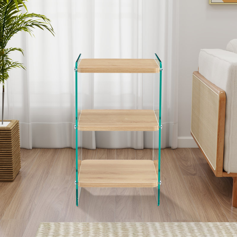 Trois niveaux de tables de chevet. La surface de la planche est en MDF, avec des autocollants, et les deux côtés sont en verre trempé transparent. La conception est simple et généreuse, avec fonction de rangement