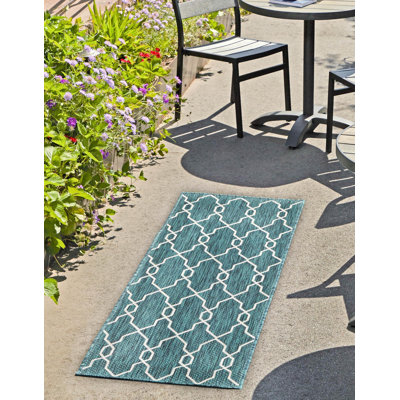 Tapis intérieur / extérieur bleu sarcelle Joniell