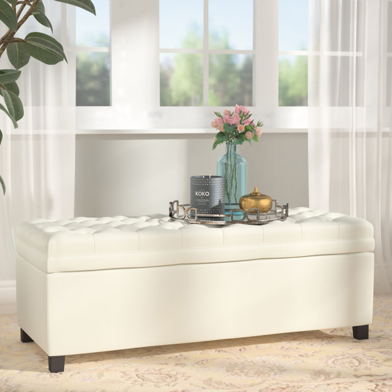19.75'' Wide Tufted Rectangle Storage Ottoman Padded, button-tufted top stained legs Doubles as extra seating