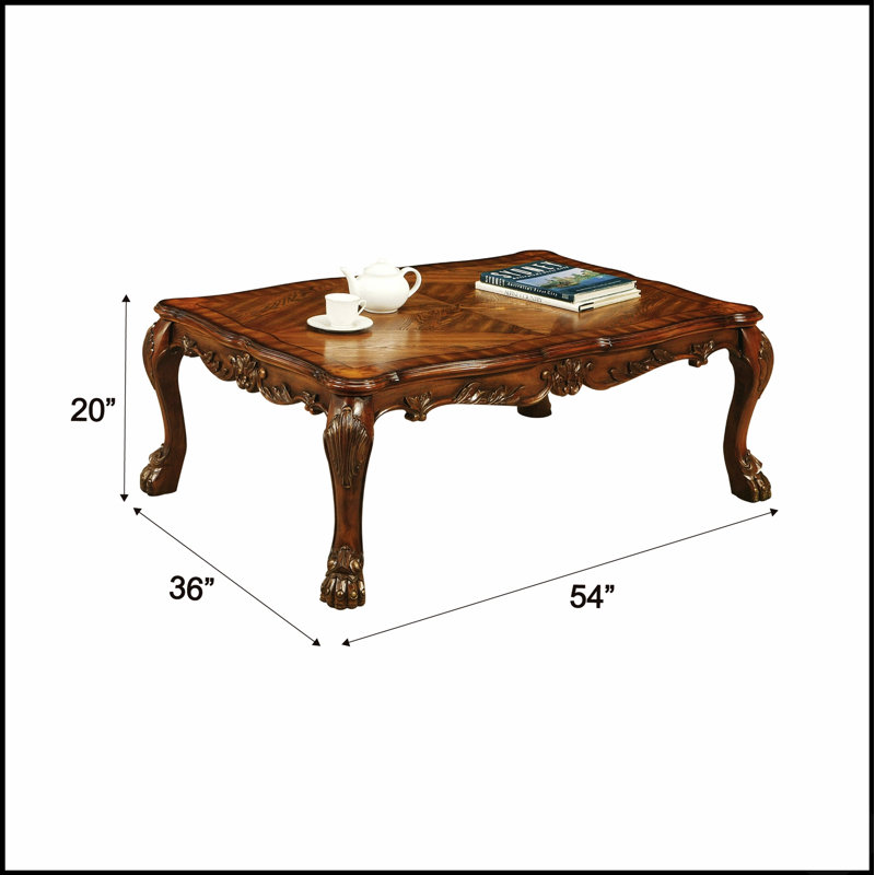 Table basse en chêne cerisier avec pieds à griffes, surface réfléchissante moderne et espace de rangement intégré