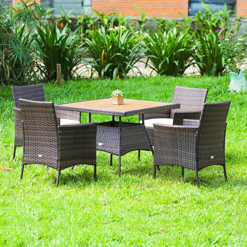 Akyrie 4 - Person Acacia Wicker Patio Dining Set with Square Table , Cushions Included