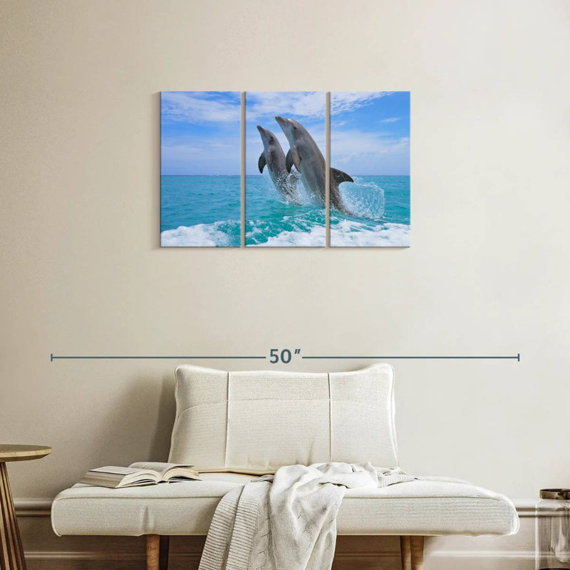 Bramph dauphins jouant en mer, H 20 po x l 33 po