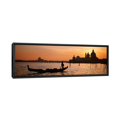 " Silhouette of a gondola in a canal at sunset, Santa Maria Della Salute, Venice, Italy " Color Photography