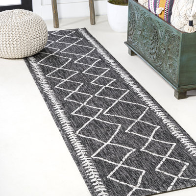 Tapis intérieur / extérieur noir / ivoire Muirhead Tribal Diamond Trellis