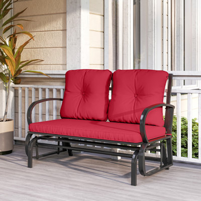 Chaise berçante d'extérieur en métal avec coussins
