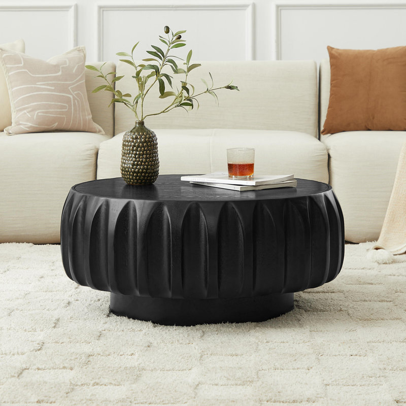 Table basse ronde en bois massif sculpté