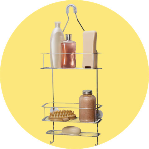 A wire hanging shower caddy with two shelves, hooks, and suction cups, isolated on a circular yellow background.