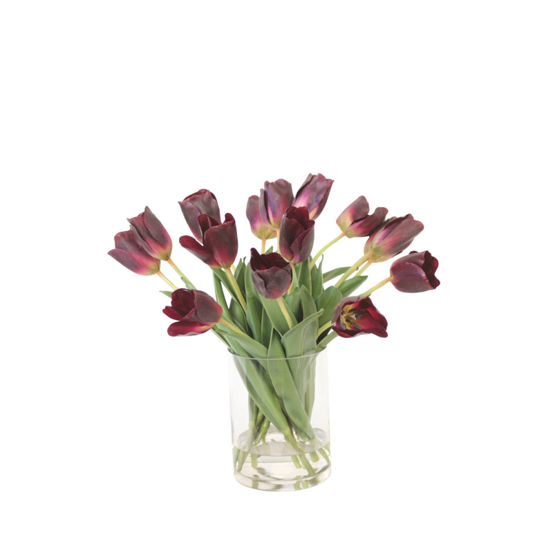 Tulipes améthyste dans un vase en verre