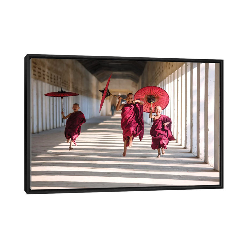 " Three Monks Running, Burma " by Matteo Colombo, 18" H x 26" W x 1.5" D, Black Floater Framed Canvas, No Mat