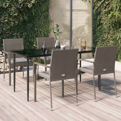 Dassiah 4 - Person Patio Dining Set Rectangular Table with Cushions Included