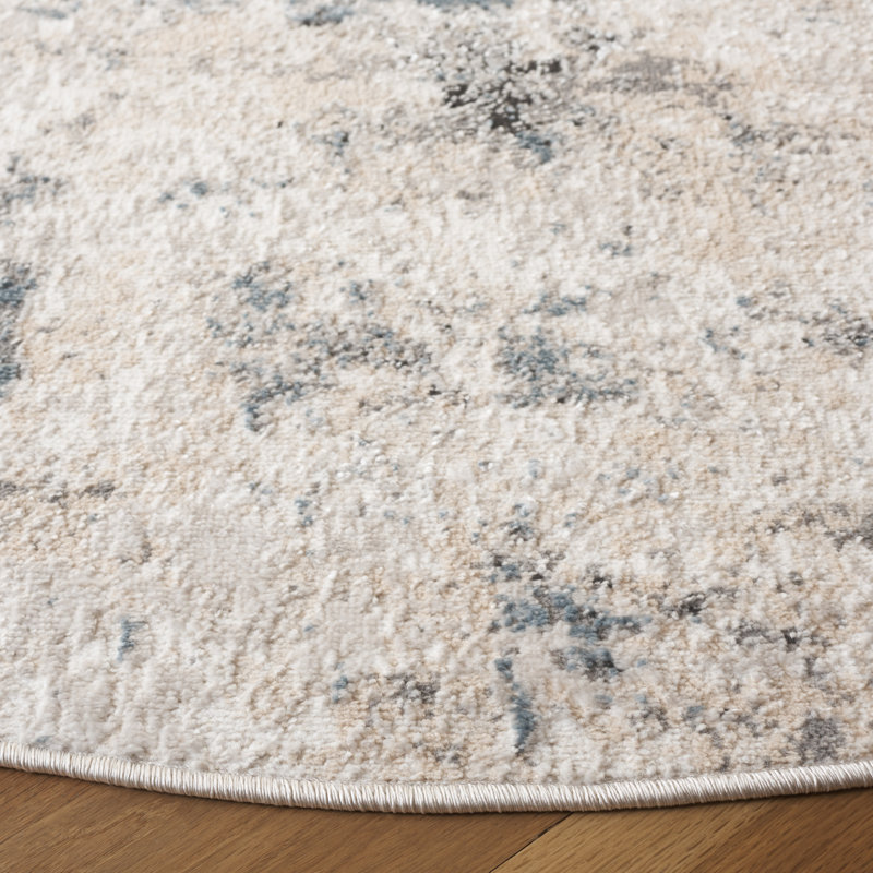 Ivory and Beige Abstract Synthetic 8' x 10' Rug