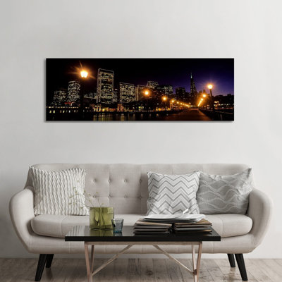 Buildings At The Waterfront Lit Up At Night, San Francisco, California, USA by Panoramic Images - Wrapped Canvas Panoramic Print