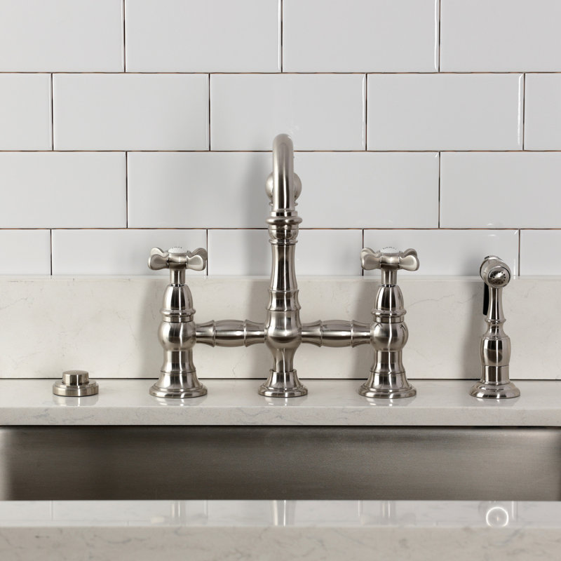 Kingston Brass Essex Two-Handle 4-Hole Deck Mount Bridge Kitchen Faucet With Brass Side Sprayer, Brushed Nickel