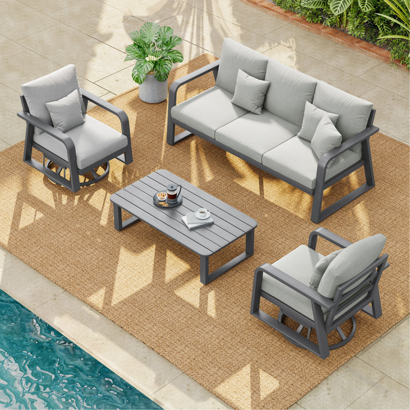 Un canapé trois places + deux chaises pivotantes + une table basse