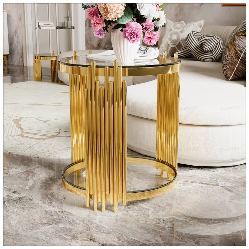 Table de bout moderne en verre transparent pour le salon, structure ronde asymétrique en métal avec tablette inférieure