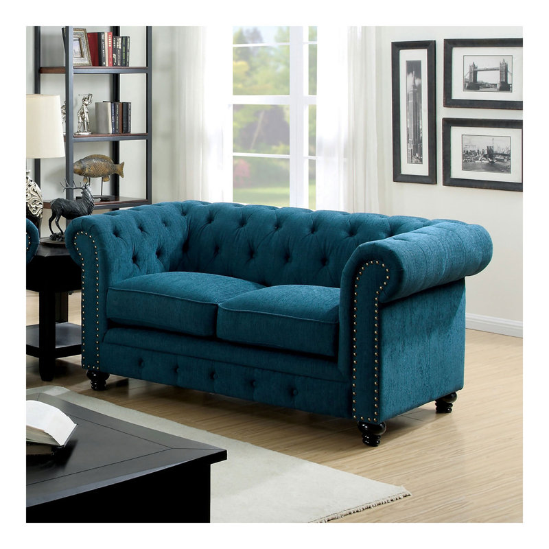 Causeuse contemporaine capitonnée de couleur bleu sarcelle à boutons capitonnés et capitonnée
