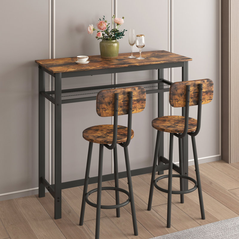 Ensemble de table à hauteur de comptoir rustique brun et 2 tabourets. Fabriqué en fer résistant. Assure une fabrication stable. Couvre-pieds antidérapants. Tabourets pliables pour plus d'espace. Élégant grain de bois en métal