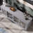 63" Retro Gray Sliding Door TV Stand With Adjustable Shelves & Hidden Storage – Modern Entertainment Center