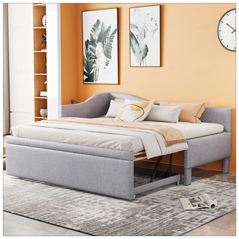 Lit de jour simple en L rembourré en forme de L avec lit gigogne escamotable, élégant et polyvalent pour tout décor