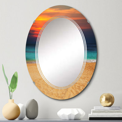Vibrant coucher de soleil orange, mauve au-dessus de la plage - Miroir mural nautique et côtier ovale