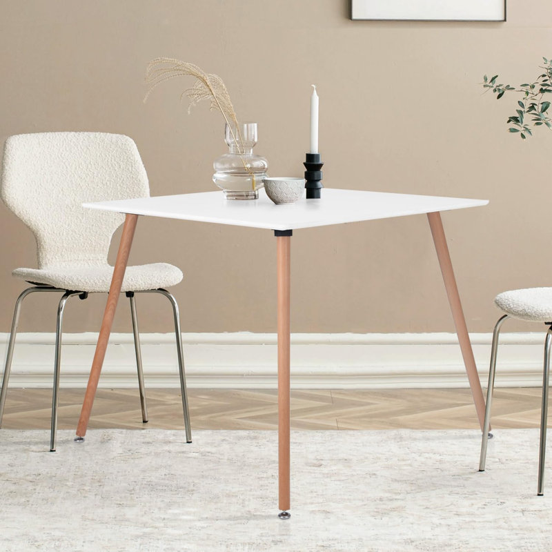 Table moderne blanche fonctionnelle avec pieds en bois