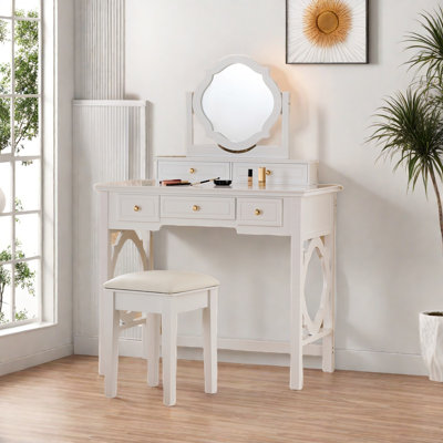 Elegant Makeup Vanity Table With Reversible Four-leaf Shaped Mirror, 5 Drawers, Golden Round Handles And A Stool by Lark Manor