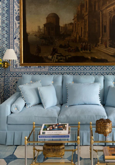 Blue Couch in patterned room
