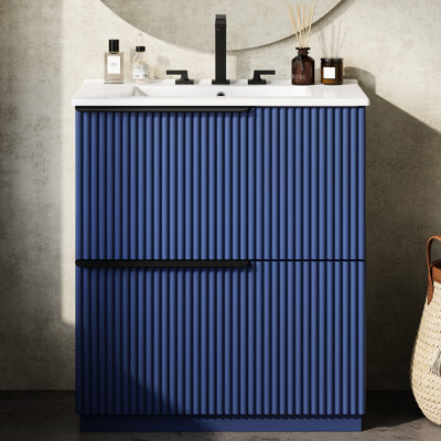 Meuble-lavabo de 30 po en bleu avec un design cannelé, deux tiroirs, un comptoir brillant et un lavabo autoportant en céramique