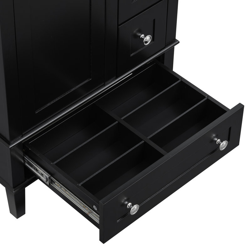 Ce meuble-lavabo noir de 24 pouces avec lavabo en céramique intégré comprend une tablette à double couche, des tiroirs à fermeture en douceur et une porte d'armoire à fermeture en douceur.