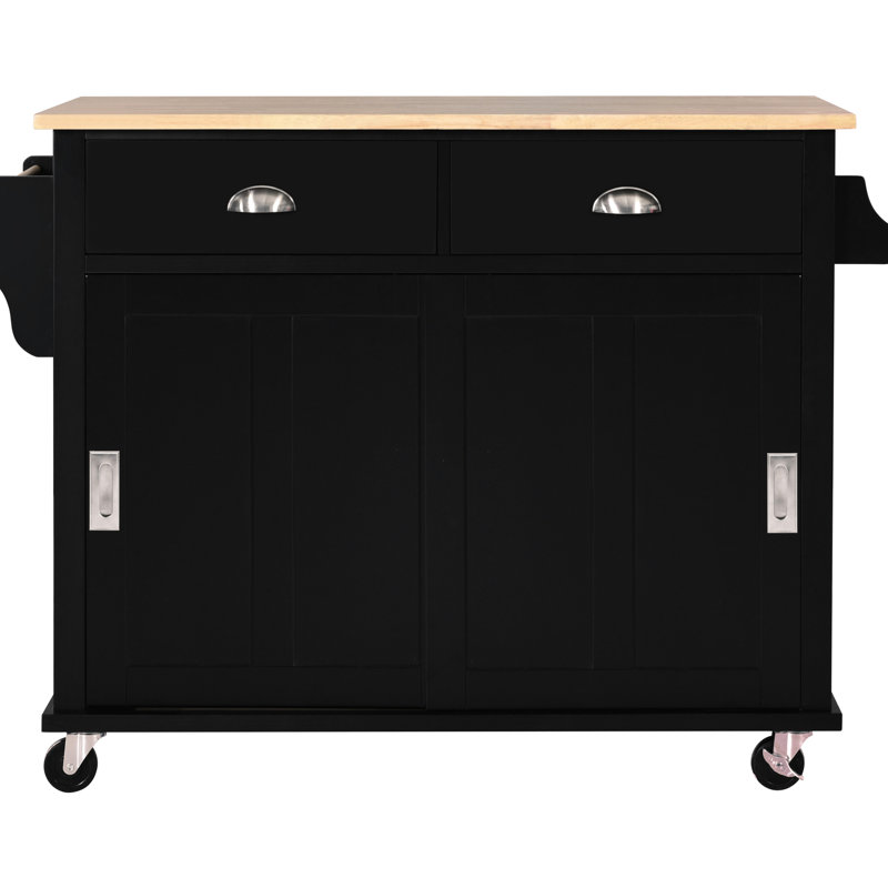 Îlot de cuisine noir avec construction, 4 roulettes et espace de tiroir fonctionnel. Rangement de comptoir. Pour la mobilité. Intérieur de porte de grange coulissant dissimulé