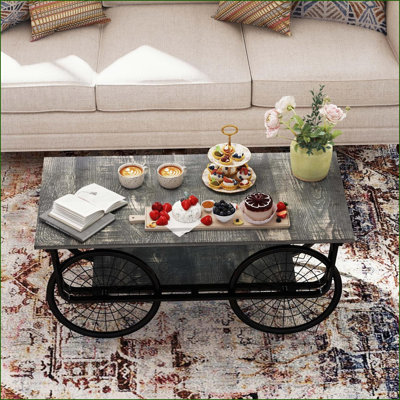 Table basse rétro noire pour le salon, construction robuste peu encombrante et style polyvalent