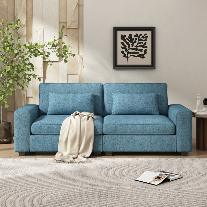 Canapé moderne en tissu avec coussins moelleux