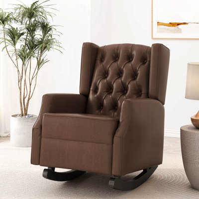 Fauteuil à bascule contemporain à oreilles avec capitonnage à boutons en losanges et patins en bois de bouleau pour un confort et un style optimaux.