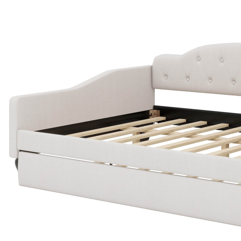 A Full-Size Upholstered Daybed  Integrated Twin-Size Trundle