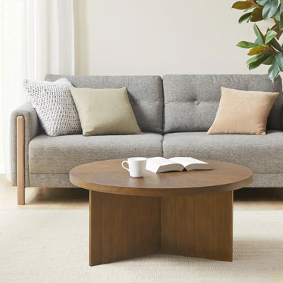 1 table basse ronde ci-dessous