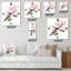 Oiseau bleu assis sur un brin de magnolia rose - Horloge murale traditionnelle-1303764179