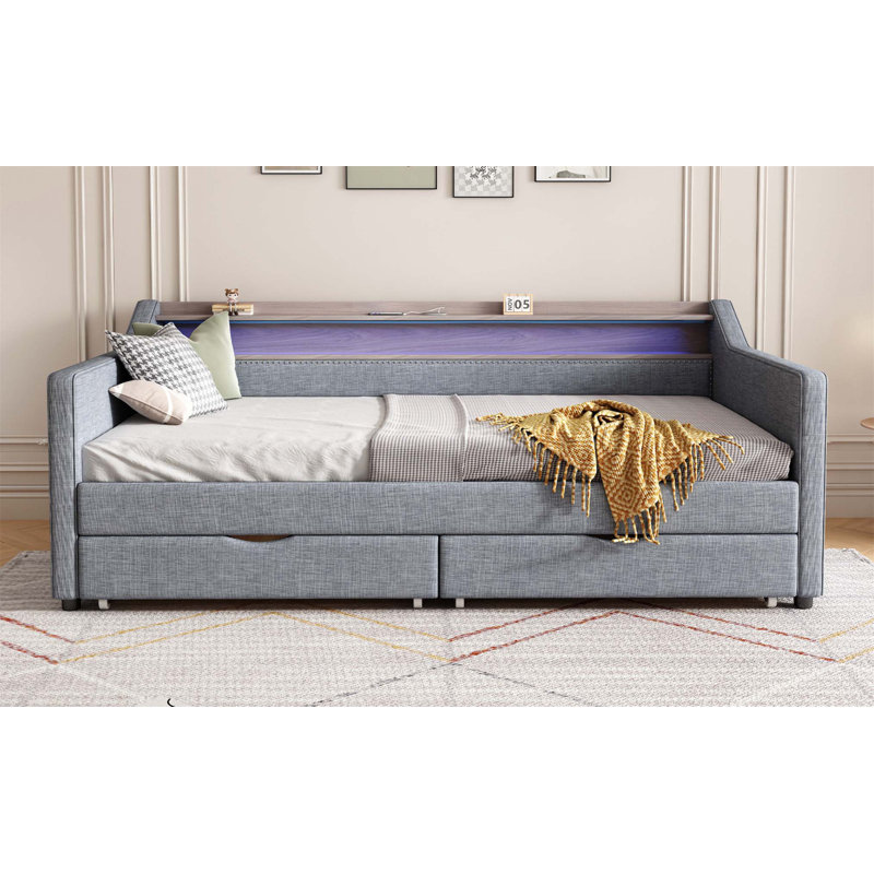 Twin Size Multifunctional Daybed with Trundle, Study Desk, Storage Shelves, and Smart LED Lighting for Compact Living Spaces.