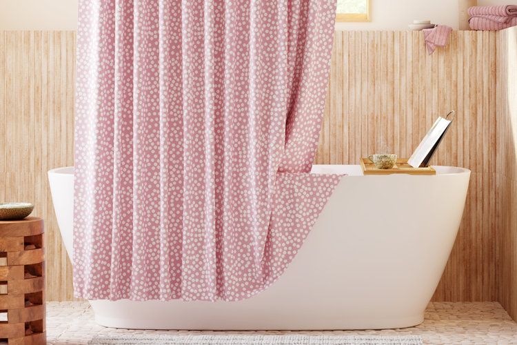 Bath with a pink-and-white polka dot shower curtain