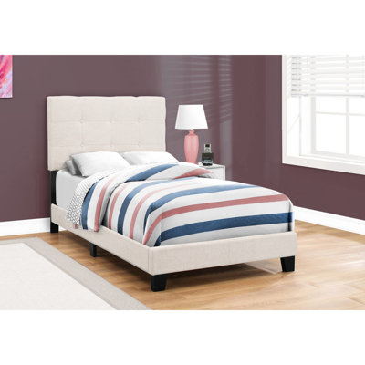 Lit plateforme simple en lin beige, structure stable et confortable pour les espaces jeunes