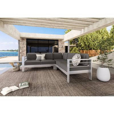 Canapé modulaire pour l'extérieur en aluminium pour 4 personnes avec lignes concentriques épurées, housses de coussins d'eau, finition en acier inoxydable, structure radiale précise de largeur gauche de l 53,25 po, revêtement non poreux, P 78,75 po
