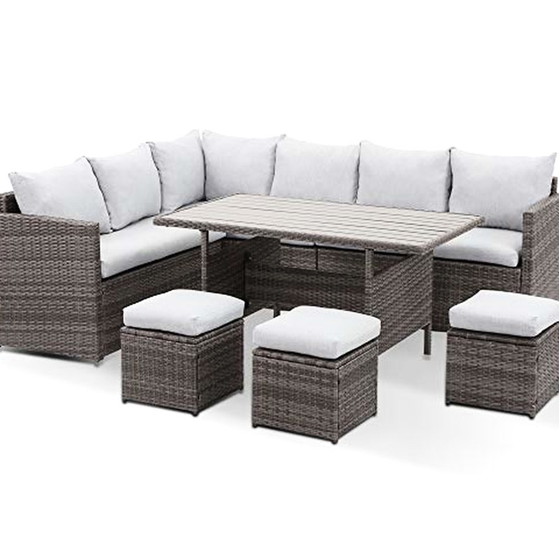 Patio gris coussiné avec 7 coussins modulaires et