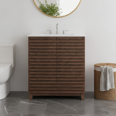 Meuble-lavabo de 76 cm avec lavabo en céramique, structure en bois massif et portes cannelées offrant un espace de rangement.